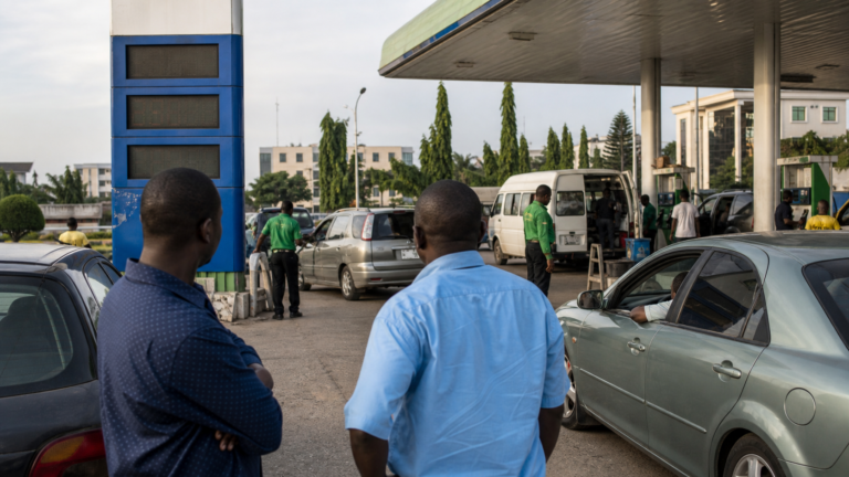 Motorists waiting at an Abuja petrol station after a price adjustment